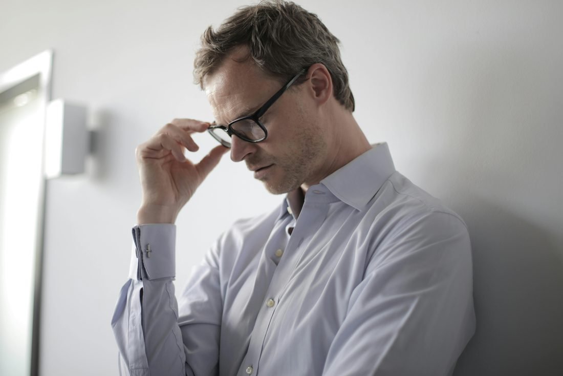 A man experiencing the fatigue and low energy of low testosterone